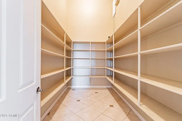 a view of a house with pool and a yard