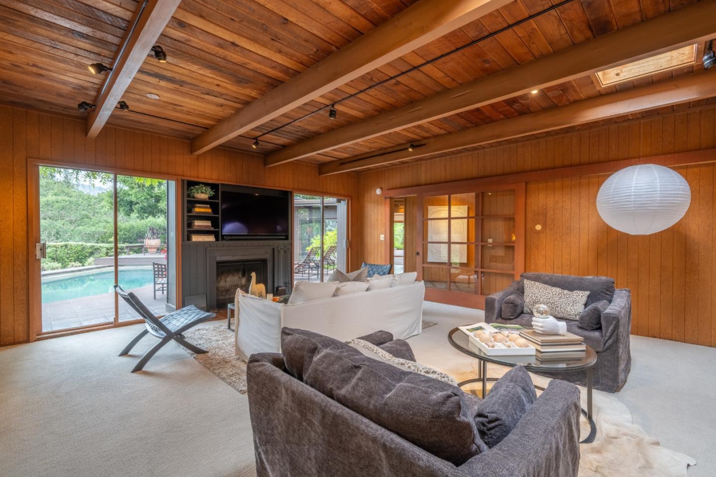 46 Middle Canyon Road Carmel Valley, CA 93924 - Photo 7 of 74 a living room with furniture a fireplace and a large window