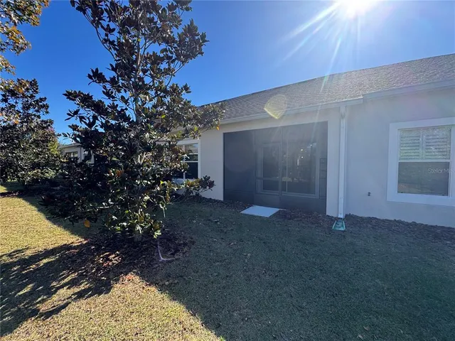 a view of a yard with a tree