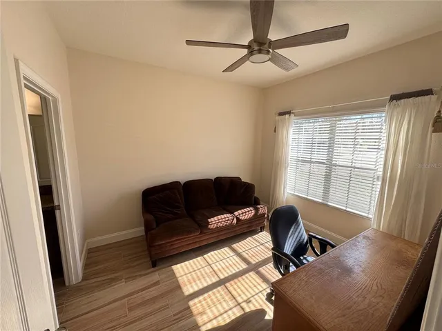 a living room with furniture and a window