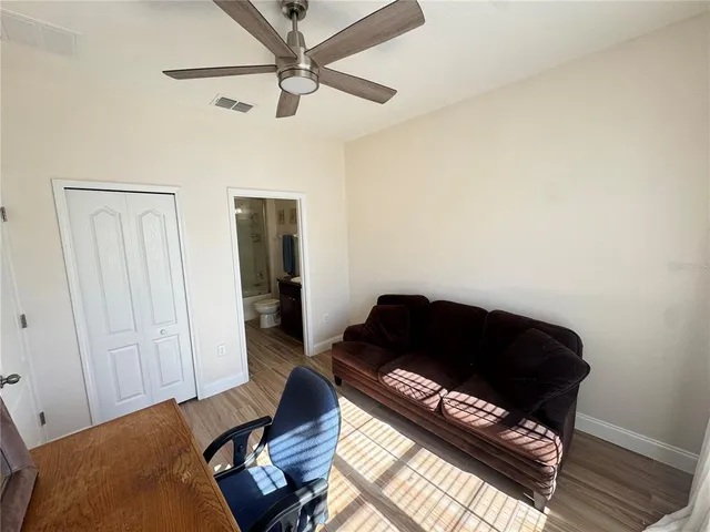 a living room with furniture and a rug