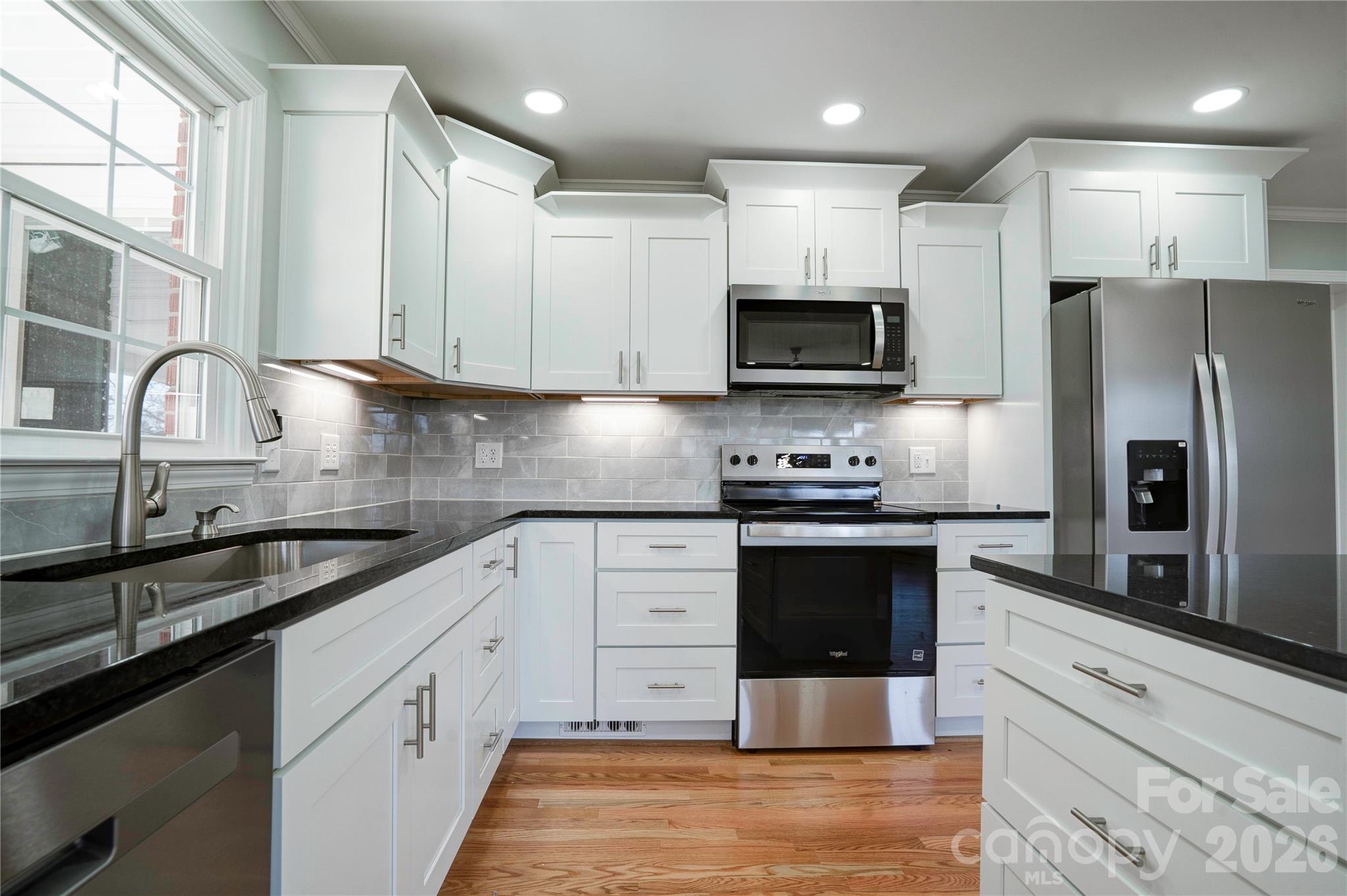 2822 Bettis Road Grover, NC 28073 - Photo 8 of 32 a kitchen with granite countertop a refrigerator stove and sink