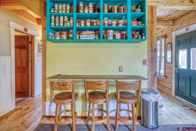 a view of an chairs and table in a room