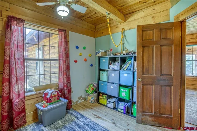 a view of an entryway with wooden floor