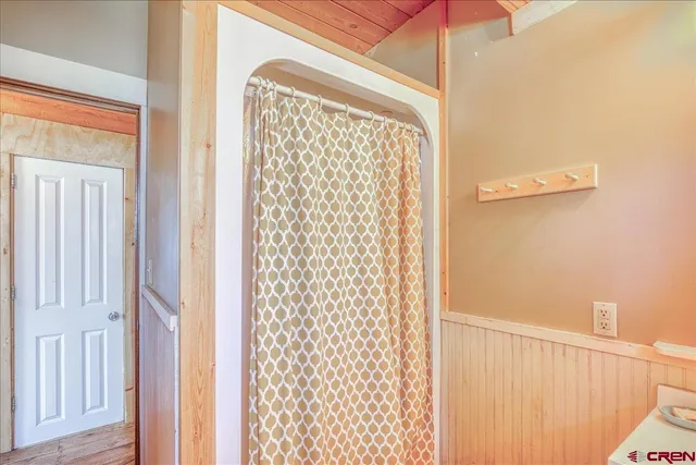 a bed room with a bed and a window