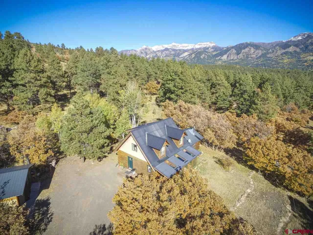 a view of a city with mountains in the background