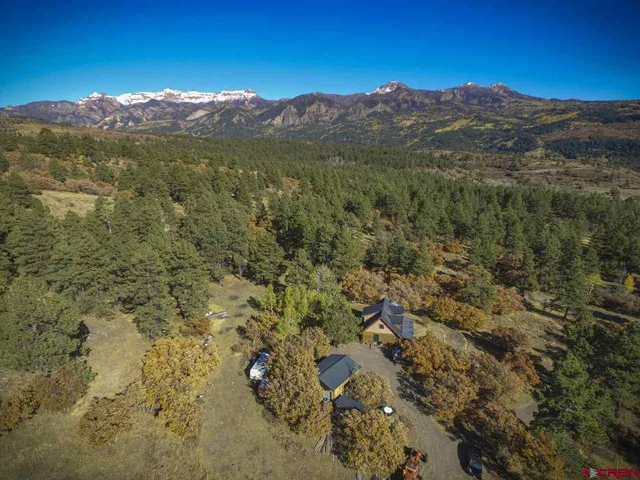 a view of a mountain range with mountains in the background