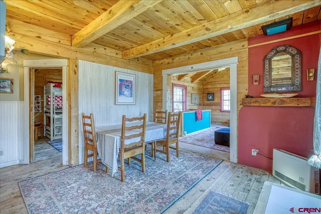 a view of a livingroom with furniture wooden floor and a rug