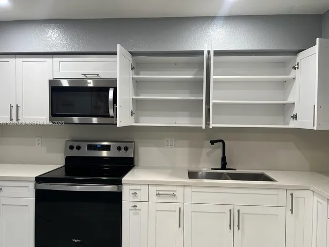 a view of staircase with wooden floor
