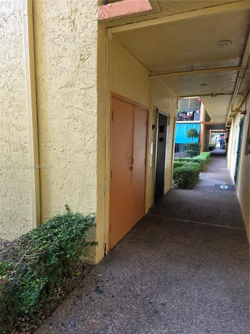 a view of a building with a street