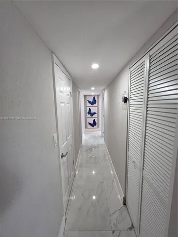 a view of a swimming pool and sitting area