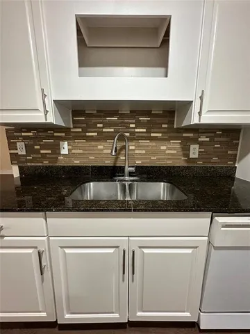a close view of a stove top oven and sink