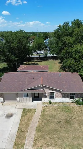 an aerial view of a house with a garden