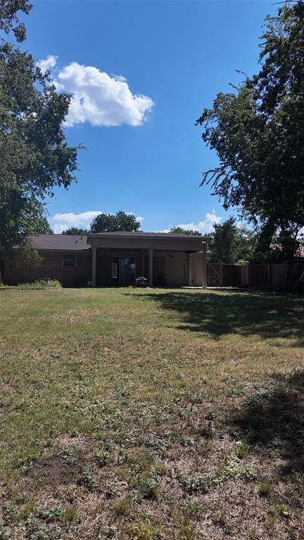 1609 Running River Road Garland, TX 75044 - Photo 35 of 37 a view of a house with a yard