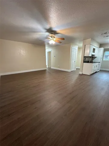 a view of a livingroom with wooden floor