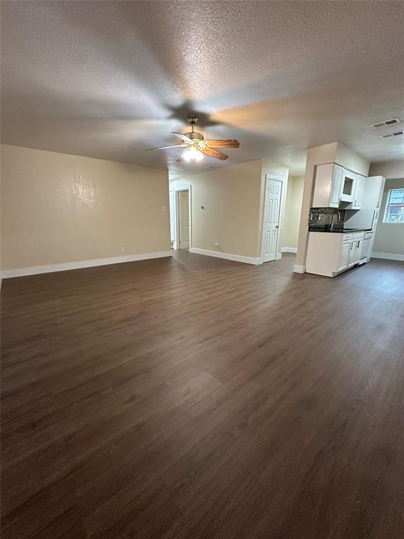 1609 Running River Road Garland, TX 75044 - Photo 7 of 37 a view of a livingroom with wooden floor