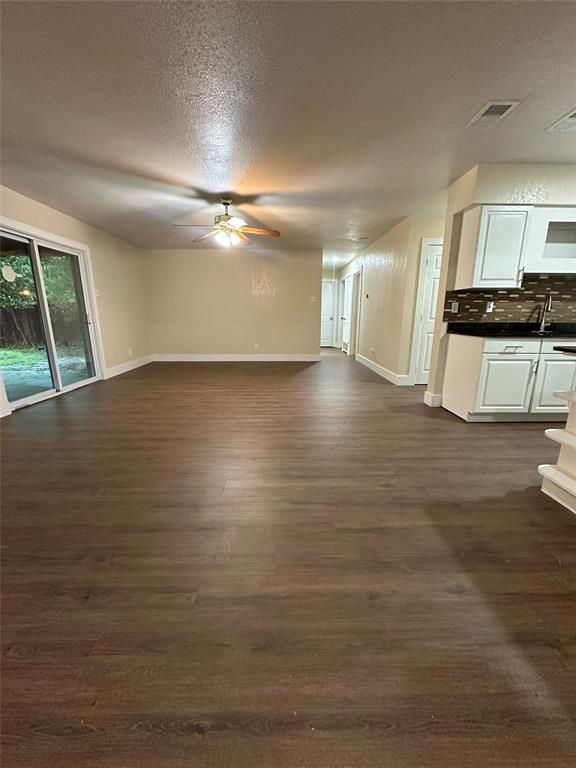 1609 Running River Road Garland, TX 75044 - Photo 9 of 37 a view of an empty room with a window