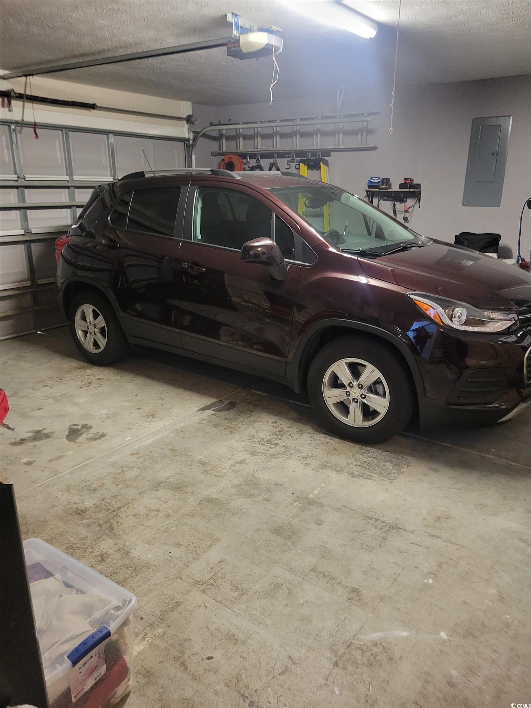 405 Beulah Circle Conway, SC 29527 - Photo 28 of 28 Garage with electric panel and a garage door opener