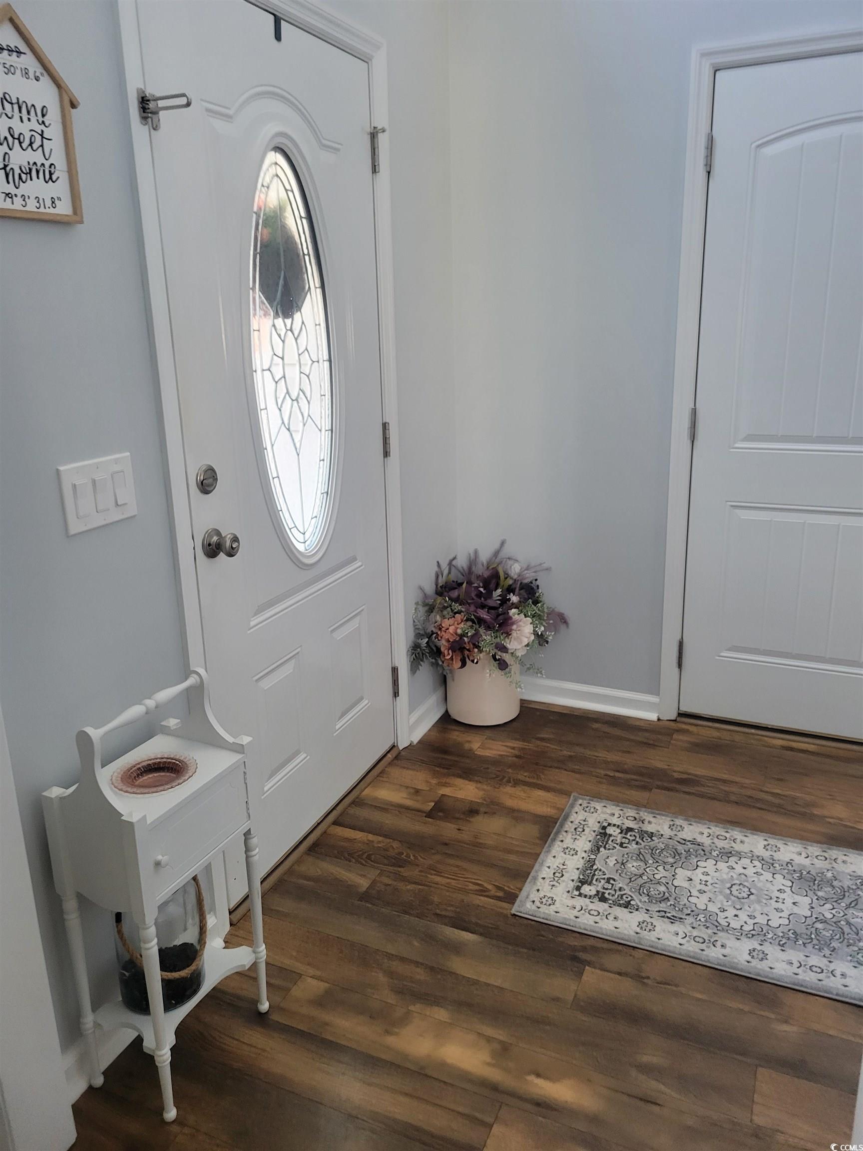 405 Beulah Circle Conway, SC 29527 - Photo 3 of 28 Entrance foyer with dark wood-type flooring and baseboards