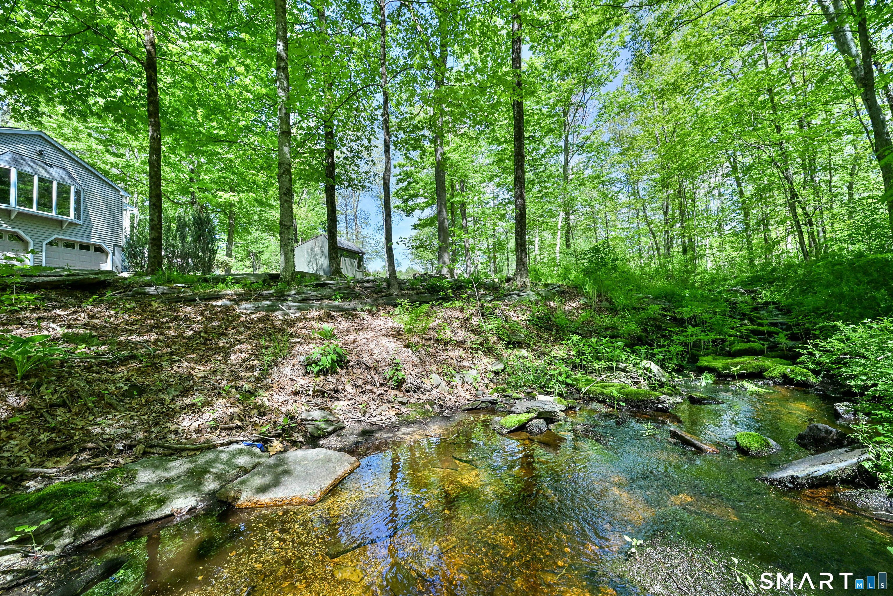 309 O'Leary Road Thompson, CT 06277 - Photo 10 of 40 a backyard of a house with lots of green space