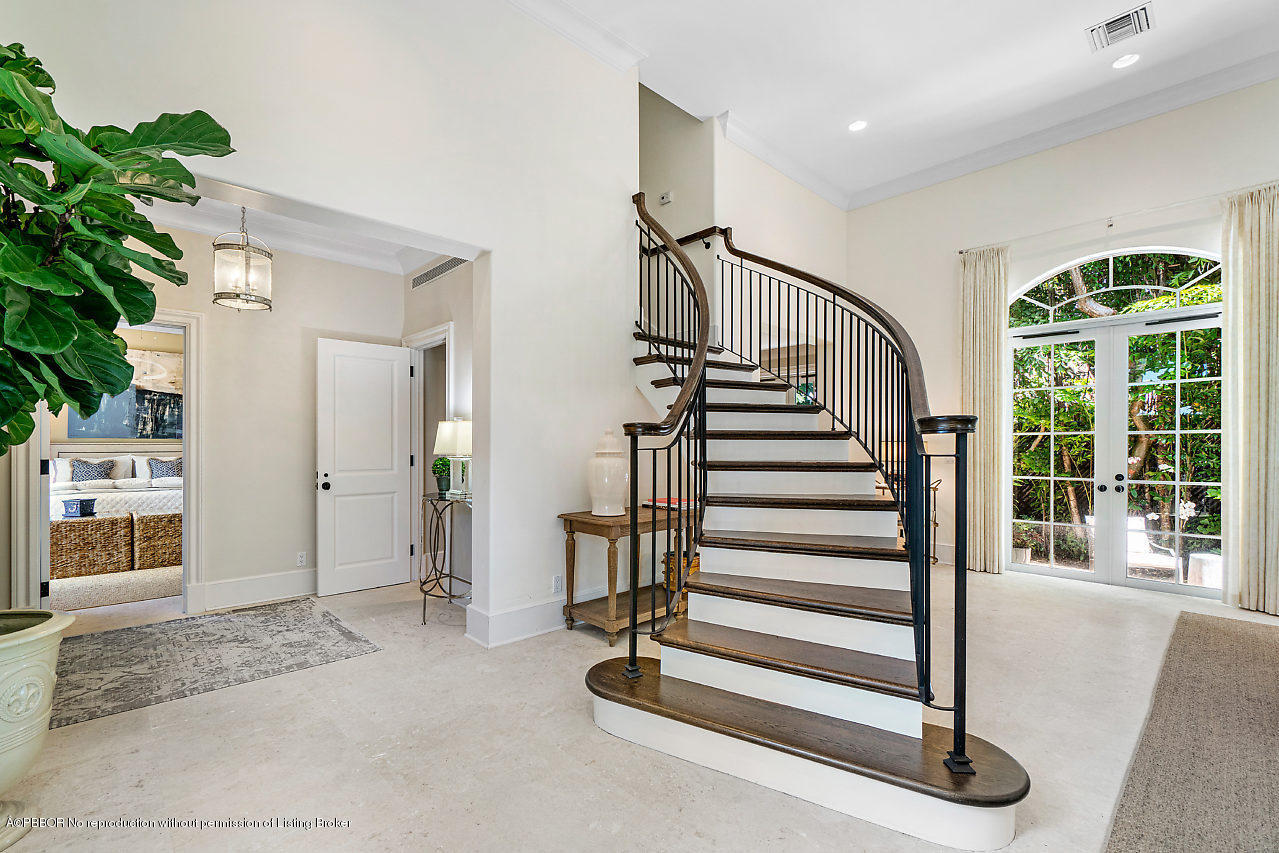 165 Root Trail Palm Beach, FL 33480 - Photo 18 of 39 a view of a hallway with entryway wooden floor and windows
