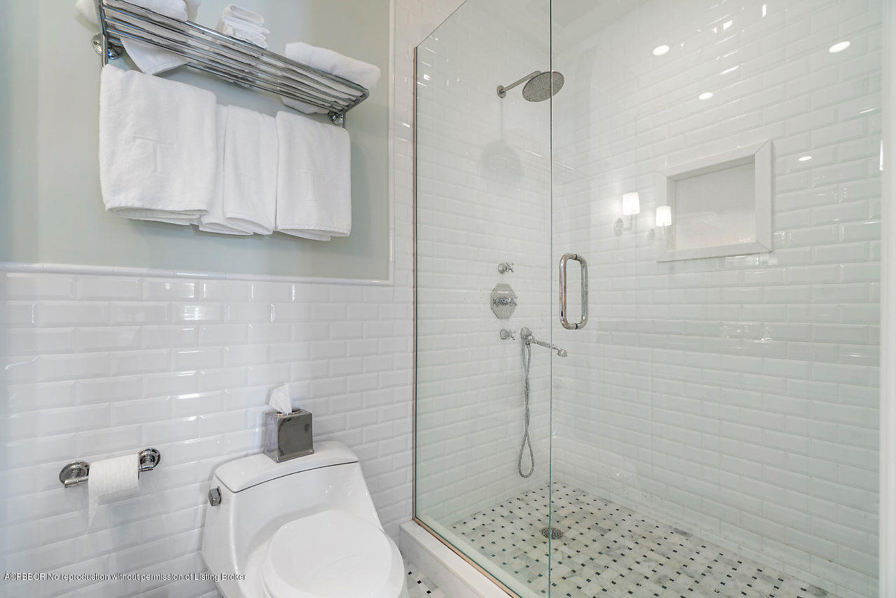 165 Root Trail Palm Beach, FL 33480 - Photo 22 of 39 a bathroom with a toilet and shower