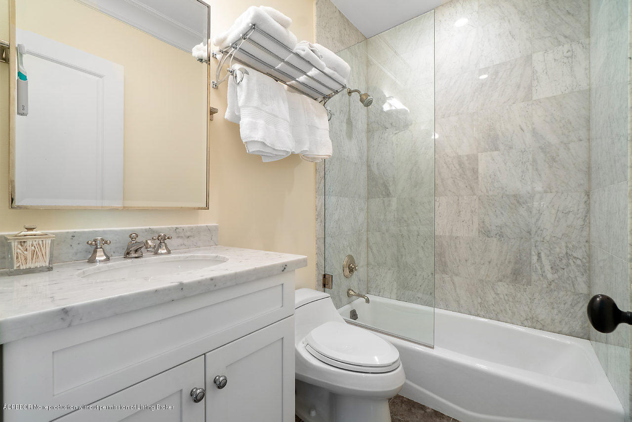 165 Root Trail Palm Beach, FL 33480 - Photo 24 of 39 a bathroom with a sink a toilet and a bathtub