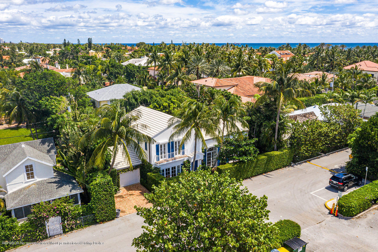 165 Root Trail Palm Beach, FL 33480 - Photo 4 of 39 a view of a house with a yard and lake view
