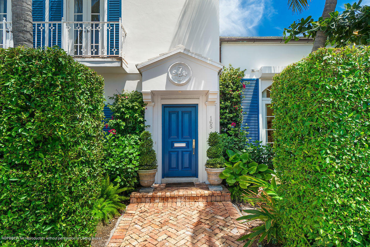 165 Root Trail Palm Beach, FL 33480 - Photo 35 of 39 a view of a house with plants and trees