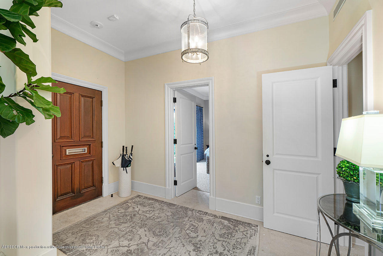165 Root Trail Palm Beach, FL 33480 - Photo 5 of 39 a view of a hallway with entryway door