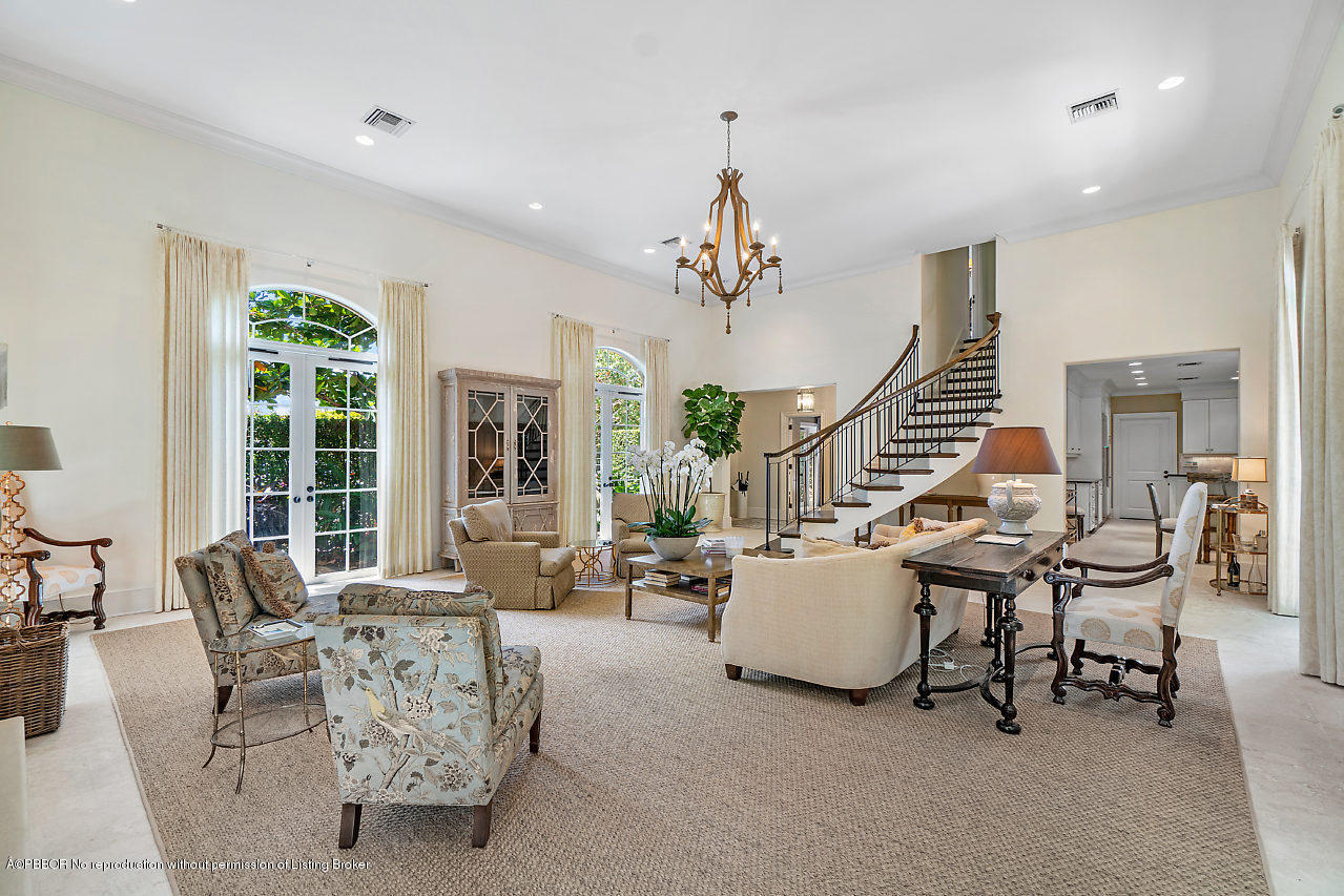 165 Root Trail Palm Beach, FL 33480 - Photo 7 of 39 a living room with furniture and a large window