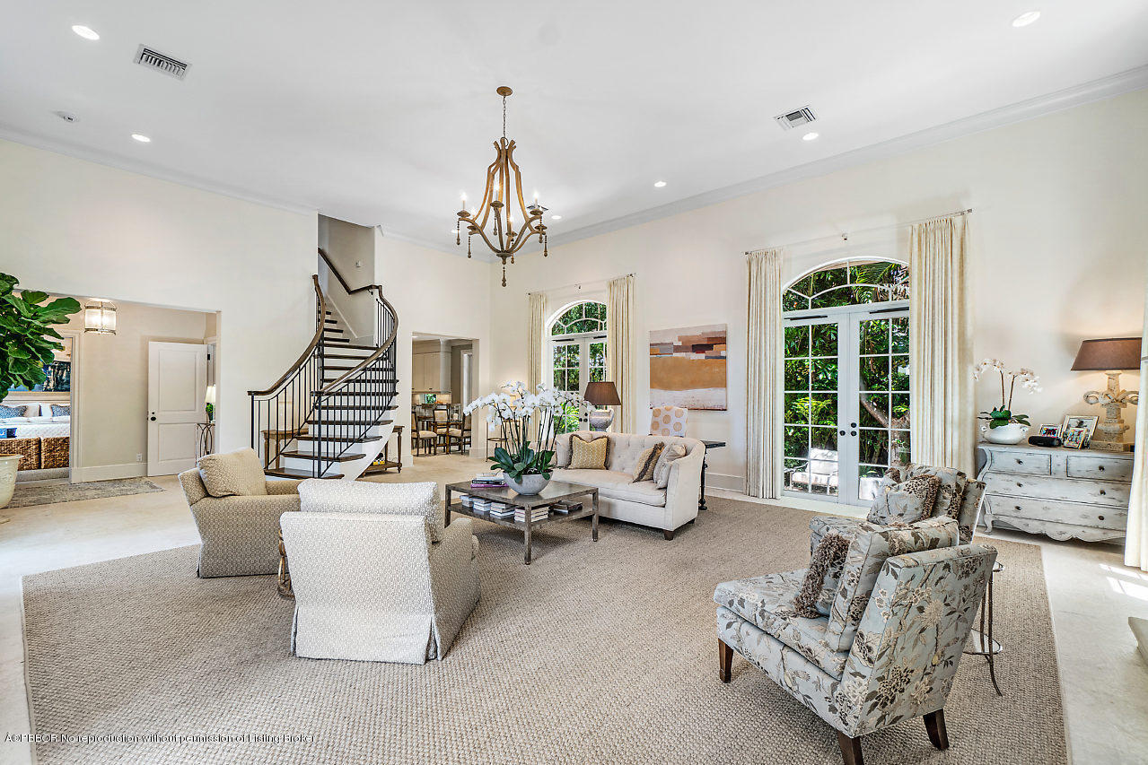 165 Root Trail Palm Beach, FL 33480 - Photo 9 of 39 a living room with furniture chandelier and fireplace