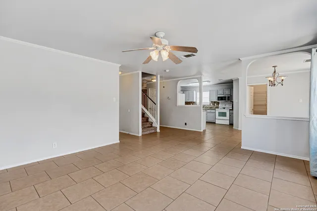 a view of a kitchen with a sink and a refrigerator