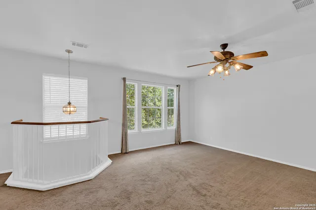 a view of an empty room with a window