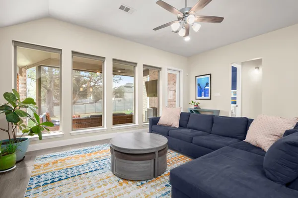 a living room with furniture and a large window