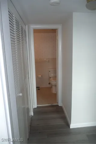 a kitchen with a refrigerator and a stove