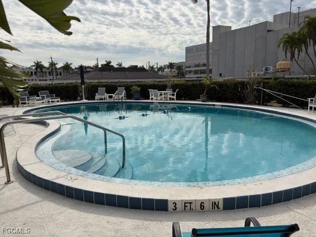a view of a swimming pool with a lounge chair