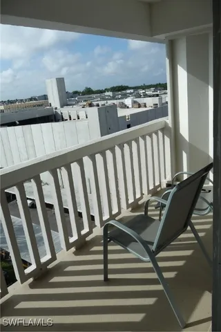 a bathroom with a granite countertop toilet sink and mirror