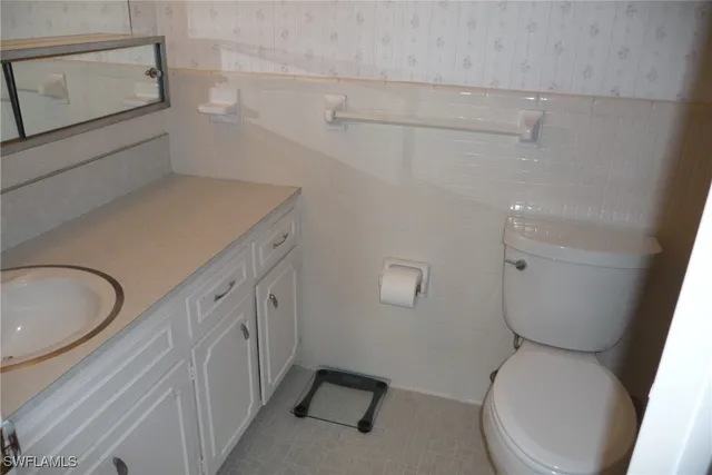 a bathroom with a shower and a toilet