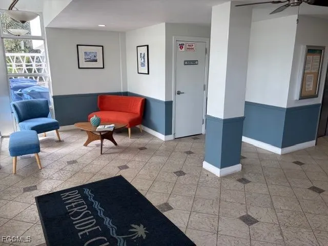 a living room with furniture and a rug