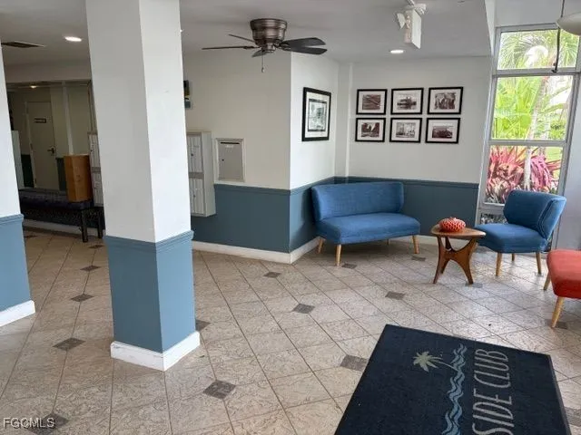 a living room with furniture and a rug