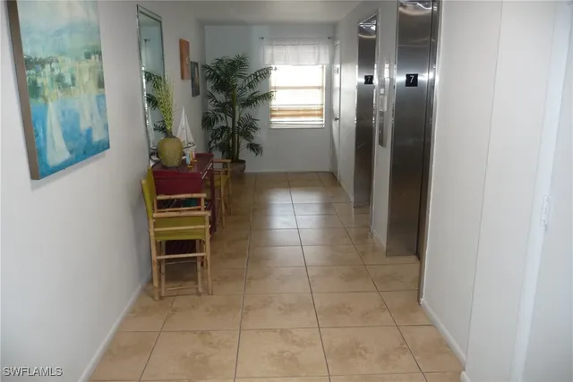 a room with furniture and a potted plant