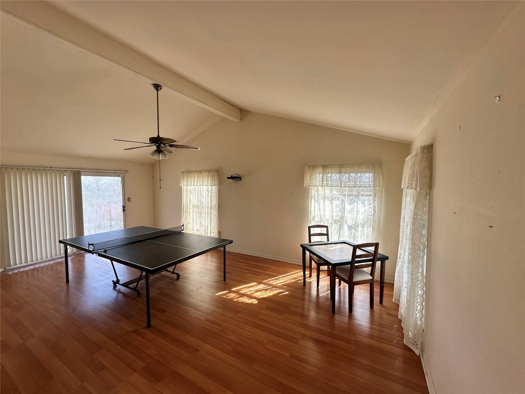 21406 Kathy Lane Spicewood, TX 78669 - Photo 14 of 40 a dining room with furniture and wooden floor