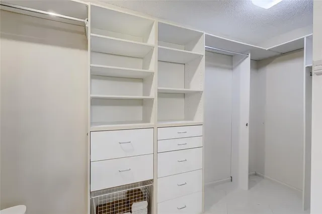 a view of an empty walk in closet