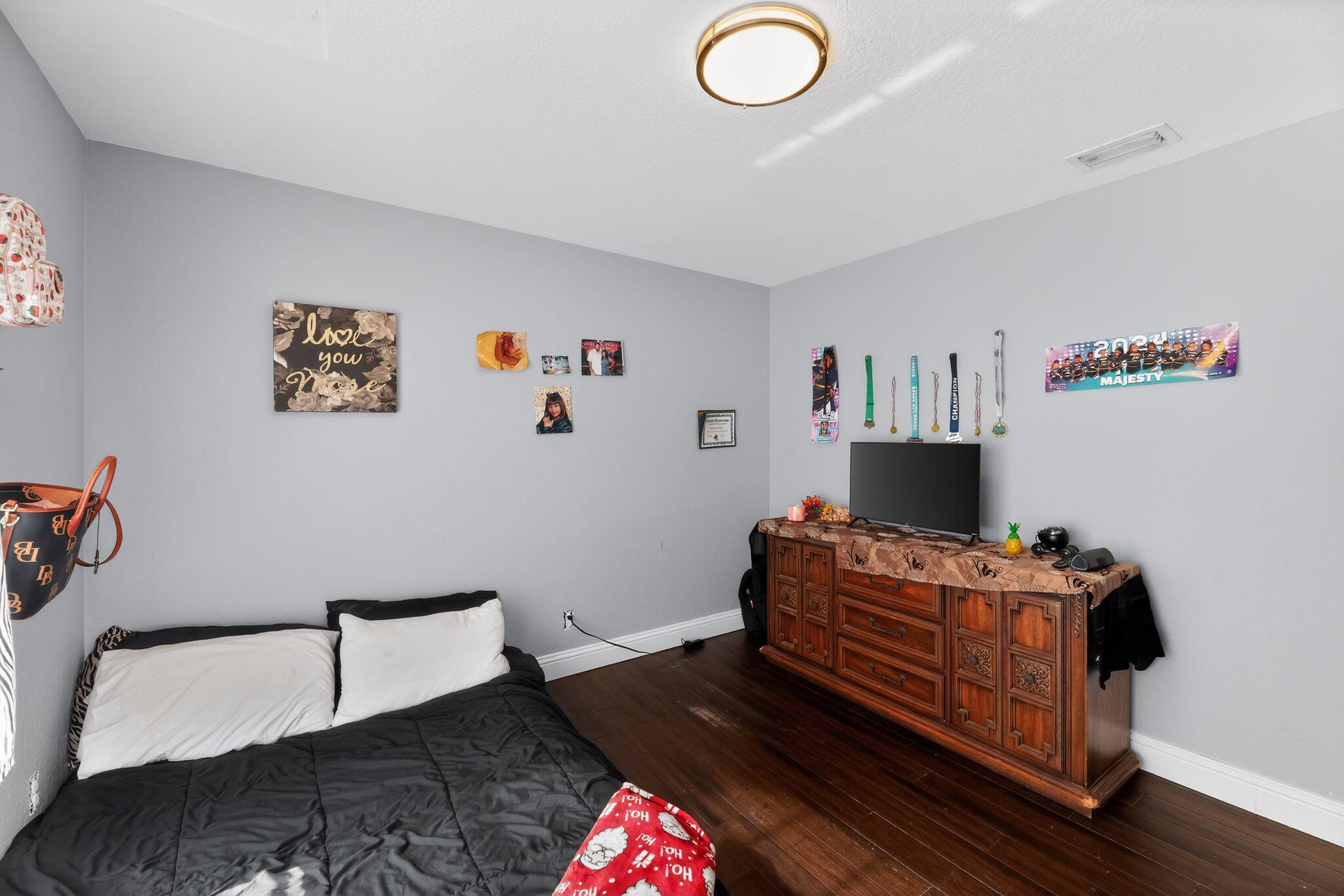 16875 68th Street North Loxahatchee, FL 33470 - Photo 15 of 26 a living room with furniture and a flat screen tv