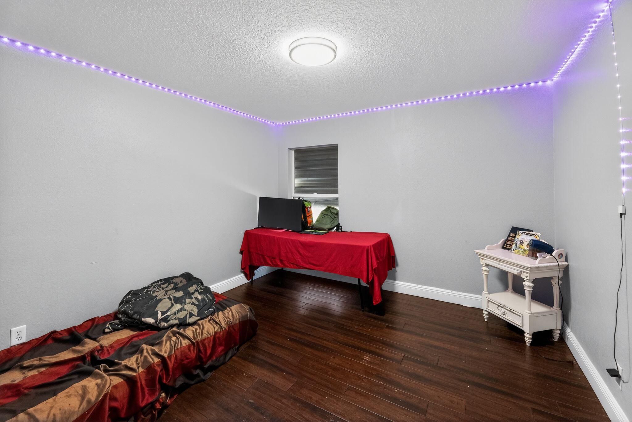 16875 68th Street North Loxahatchee, FL 33470 - Photo 18 of 26 a bedroom with a bed and a closet