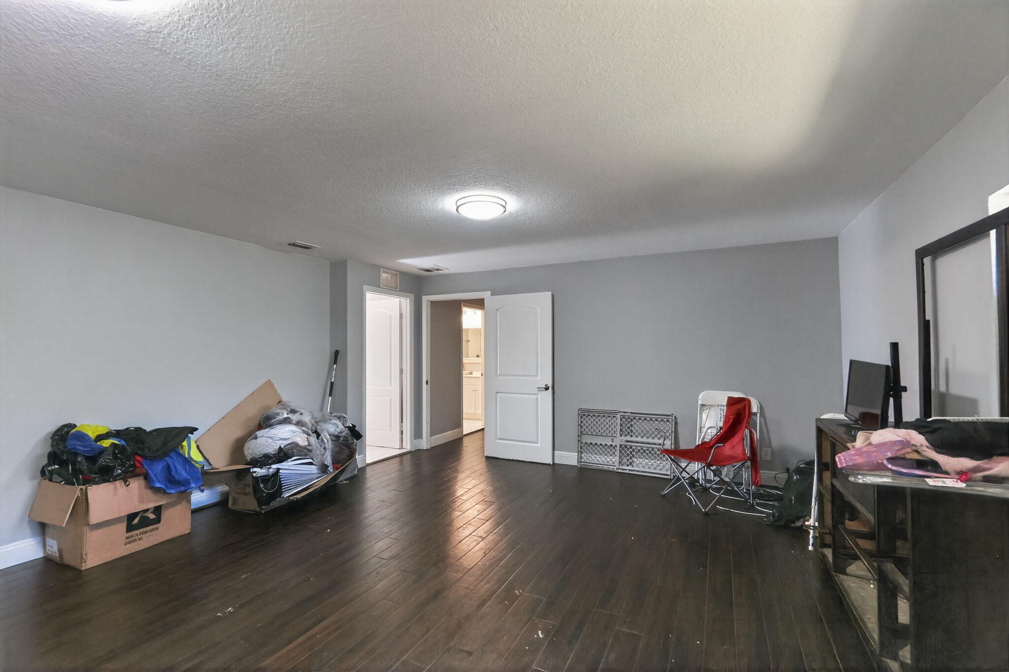 16875 68th Street North Loxahatchee, FL 33470 - Photo 26 of 26 a living room with furniture and a wooden floor