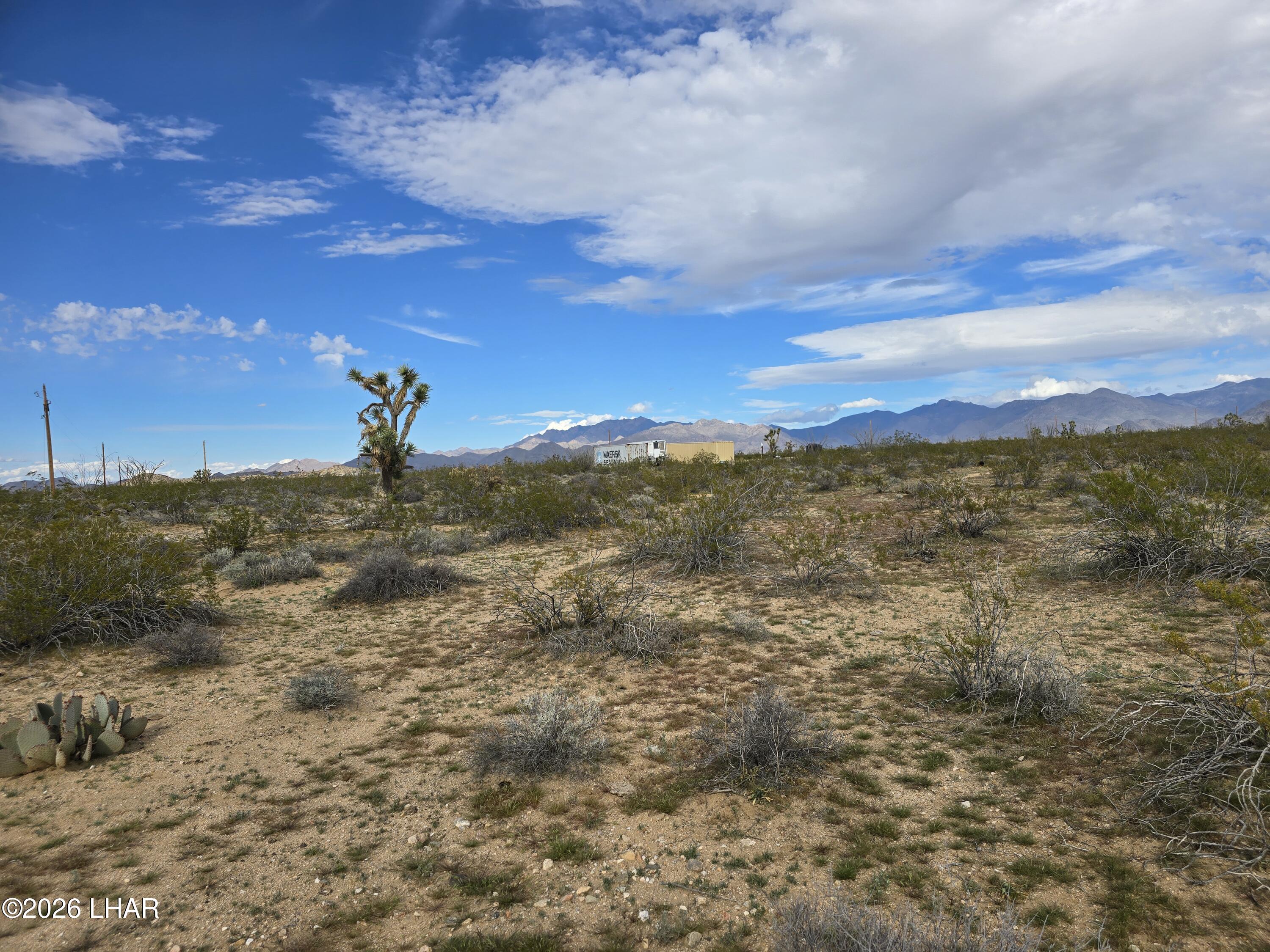 Tbd South Wild Bill Road Yucca, AZ 86438 - Photo 8 of 14 a view of a yard with an ocean
