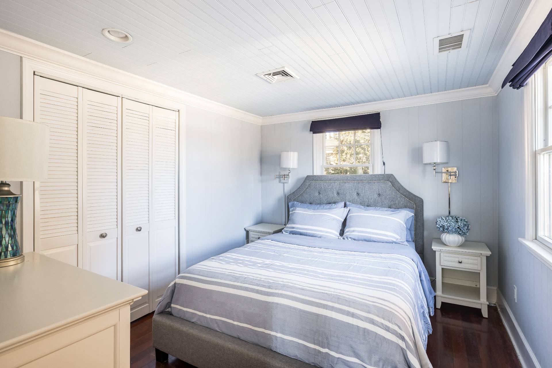 63 2nd House Road Montauk, NY 11954 - Photo 11 of 14 a bedroom with a large bed and a window