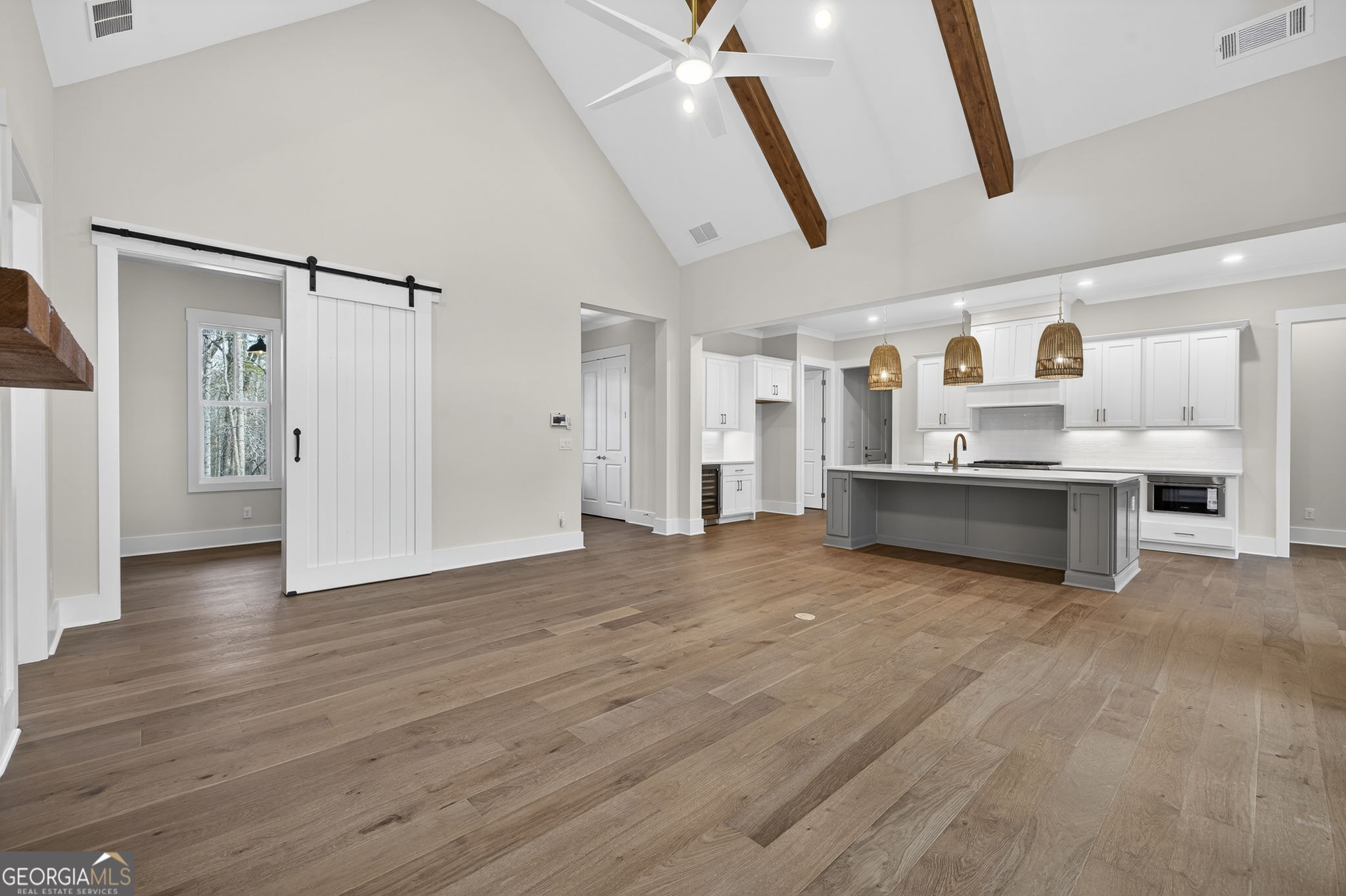 1020 Oak Valley Road Greensboro, GA 30642 - Photo 16 of 64 a view of a kitchen with wooden floor and electronic appliances